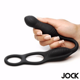 JOCK Silicone Vibrating Anal Plug with Cock and Ball Ring held in hand displaying its versatile design.