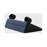 Liberator Black Label Wedge 24 inch Sex Pillow with Cuffs Blue positioned on a flat surface, showcasing its design and functionality.