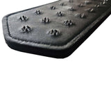 Close-up of the Rouge Leather Pin Prick Paddle showcasing its metal spikes and genuine leather texture.