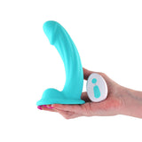 Colours Curve Vibrating 6 inch Dildo Teal with remote control in a hand on a white background.
