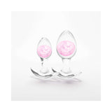 Cosmic Glams Silicone Anal Plug Kit 2pc Set Pink featuring two elegant, clear silicone plugs with pink accents.