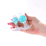 Cosmic Glams Silicone Anal Plug Kit 2pc Set Blue held in a hand, showing their alluring design and colors.