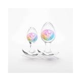 Cosmic Glams Silicone Anal Plug Kit 2pc Set Rainbow featuring two colorful silicone anal plugs.
