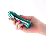Hand holding the INYA Shimmer Metallic Vibrator Aqua with a sleek metallic finish and vibrant design.