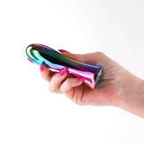 Hand holding the INYA Shimmer Metallic Vibrator Multicolor showcasing its sleek design and vibrant metallic finish.