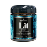 Sensuva Lit Sweet Temptation Luxury Massage Candle 4 Oz in a decorative jar with a blue design.