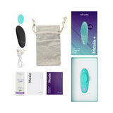 We-Vibe Moxie Plus Wearable Clitoral Vibrator Teal with accessories including pouch, charger, and lube samples.