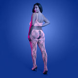 Model wearing Fantasy Lingerie Glow Equilibrium Crotchless Bodystocking with glow-in-the-dark lace, showcasing a bold look.