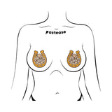 Pastease Giddy Up Sparkling Horseshoe Golden Nipple Covers shown on a model's chest, featuring gold glitter and rope-style lettering.