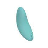 Spectrum Essentials Compact External Vibrator Blue in a smooth, pebble-shaped design for targeted stimulation.
