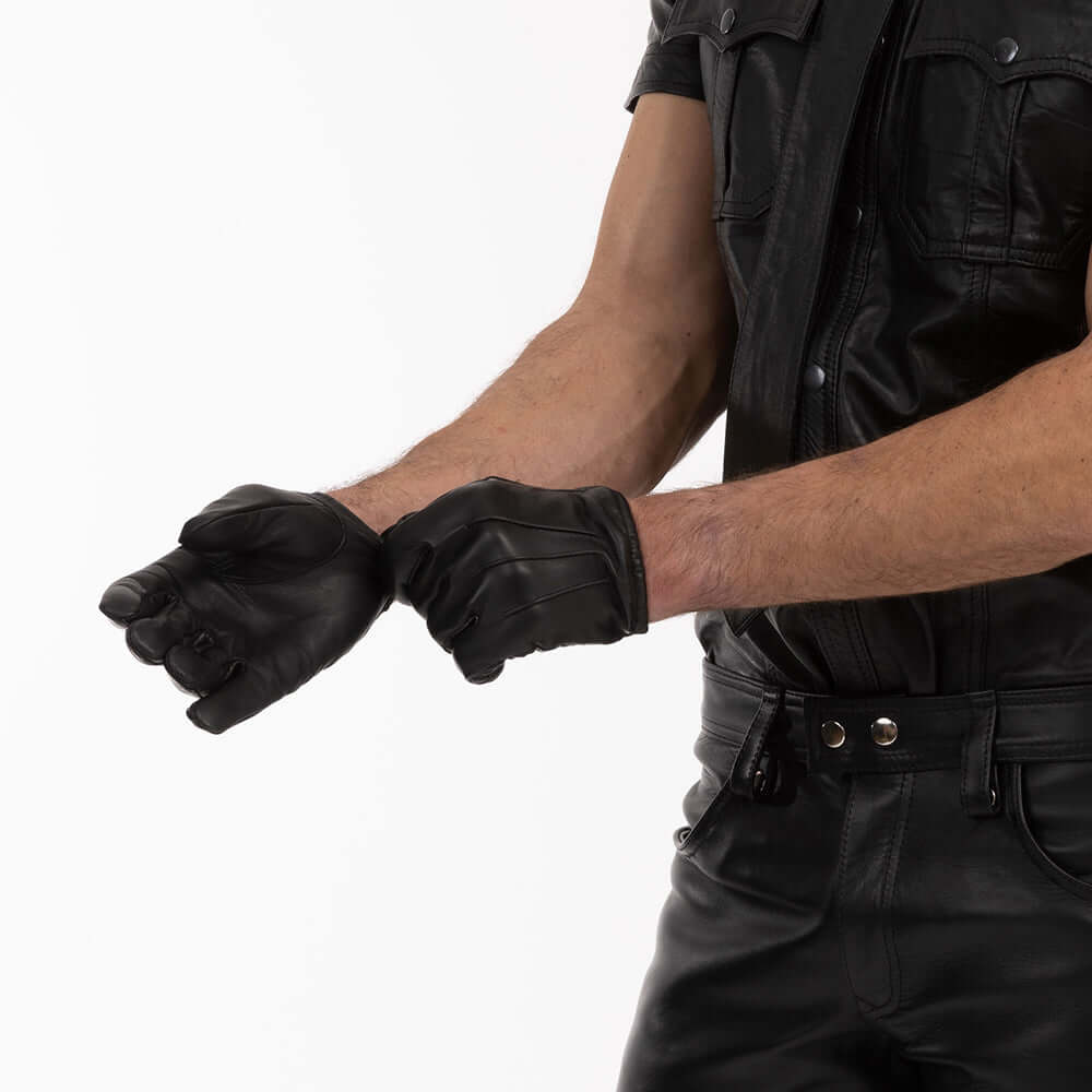 Model wearing black leather gloves, showcasing sleek design and fit, highlighting stylish accessory for bold looks.