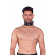 Prowler RED Leather Collar Black L XL worn by a model, showcasing durable black leather and stylish metal hardware.