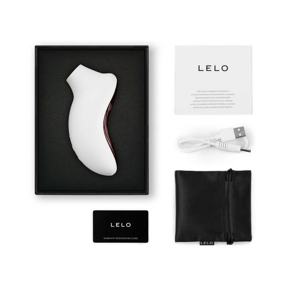 LELO SONA 3 Sonic Clitoral Massager Cream inside packaging with accessories and user guide.