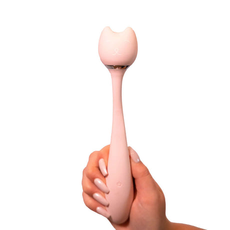 Purrs Like A Kitten Wand Vibrator held in hand, showcasing its cute cat design and sleek silicone finish.