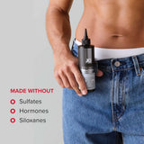 Man holding JO Stroker Lubricant 8 Oz bottle showcasing made without sulfates, hormones, siloxanes.