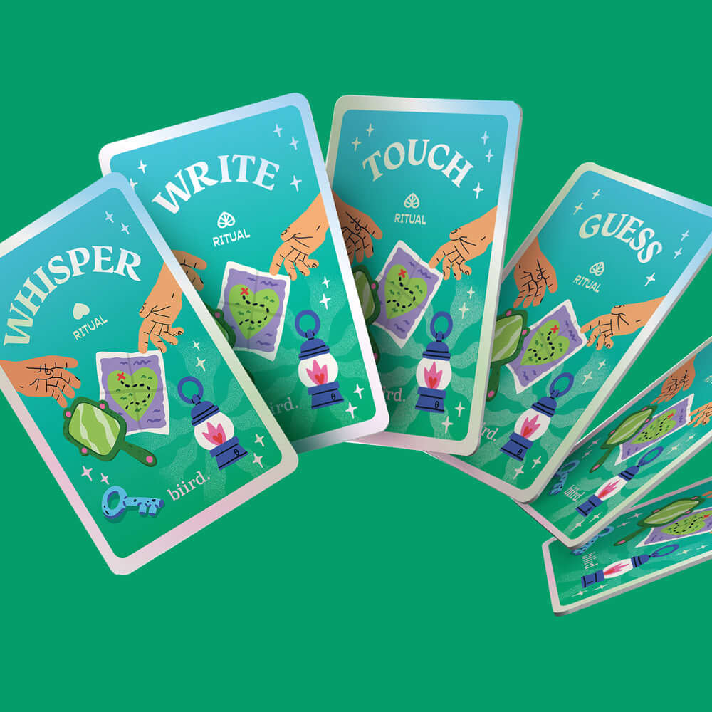 Biird x Jouissance Club Together Couples Card Game with colorful cards displaying activities like whisper, write, touch, and guess.