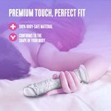 Naturally Yours Gala Sparkling Dildo Clear on a bed, showcasing its body-safe material and perfect fit for comfort.