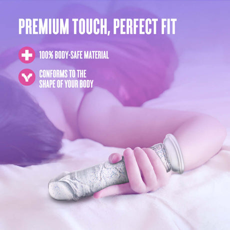 Naturally Yours Gala Sparkling Dildo Clear on a bed, showcasing its body-safe material and perfect fit for comfort.