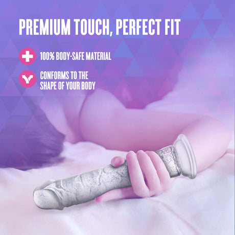 Naturally Yours Glamor Sparkling Dildo Clear on a soft surface highlighting premium touch and body-safe material.