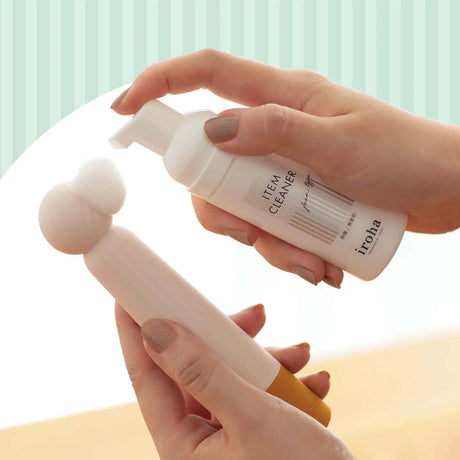 Tenga iroha Item Cleaner shown in hands, designed for gentle cleaning of intimate products.