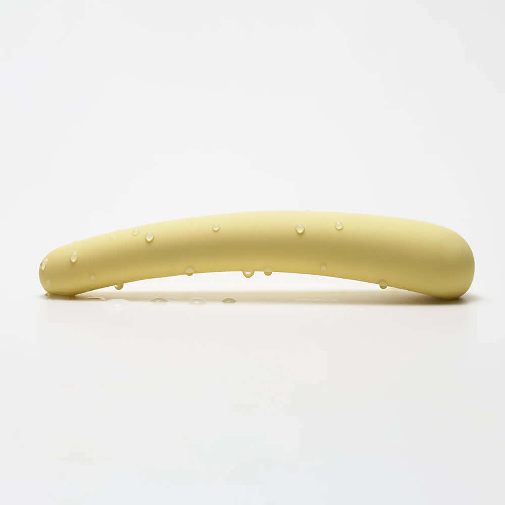 iroha tsuki MIKAZUKI Massager showcasing its elegant design and smooth finish with droplets on the surface.