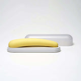 iroha tsuki MIKAZUKI Massager in a sleek white case, showcasing its elegant yellow design and ergonomic shape.