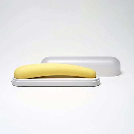 iroha tsuki MIKAZUKI Massager in a sleek white case, showcasing its elegant yellow design and ergonomic shape.