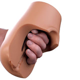 PDX Plus Pussy Pounder Squeeze Stroker Brown held in hand, showcasing its lifelike design and grip.