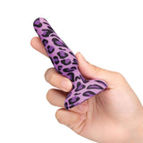 b-Vibe Novice Butt Plug Leopard held in a hand, showcasing its beginner-friendly design and vibrant leopard pattern.