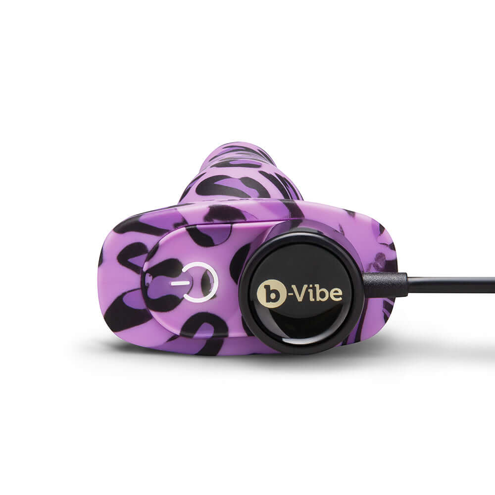 b-Vibe Novice Butt Plug Leopard in purple with a black leopard print design and control button.