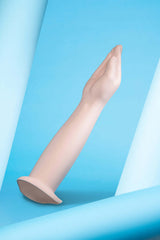 b-Vibe Silicone Hand Fisting Dildo shown on a blue backdrop highlighting its lifelike design and detail.