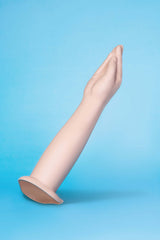 b-Vibe Silicone Hand Fisting Dildo showcasing a lifelike hand design on a blue background.