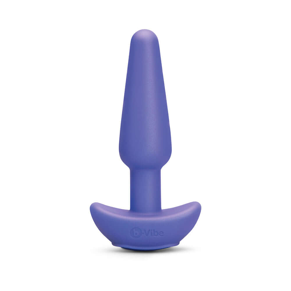 b-Vibe Butties Shake Vibrating Butt Plug in purple silicone with a sleek design for comfortable use.
