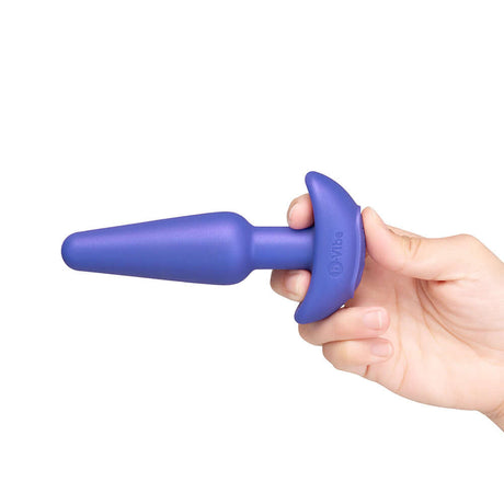 b-Vibe Butties Shake Vibrating Butt Plug held in hand, showcasing its sleek design and premium silicone material.
