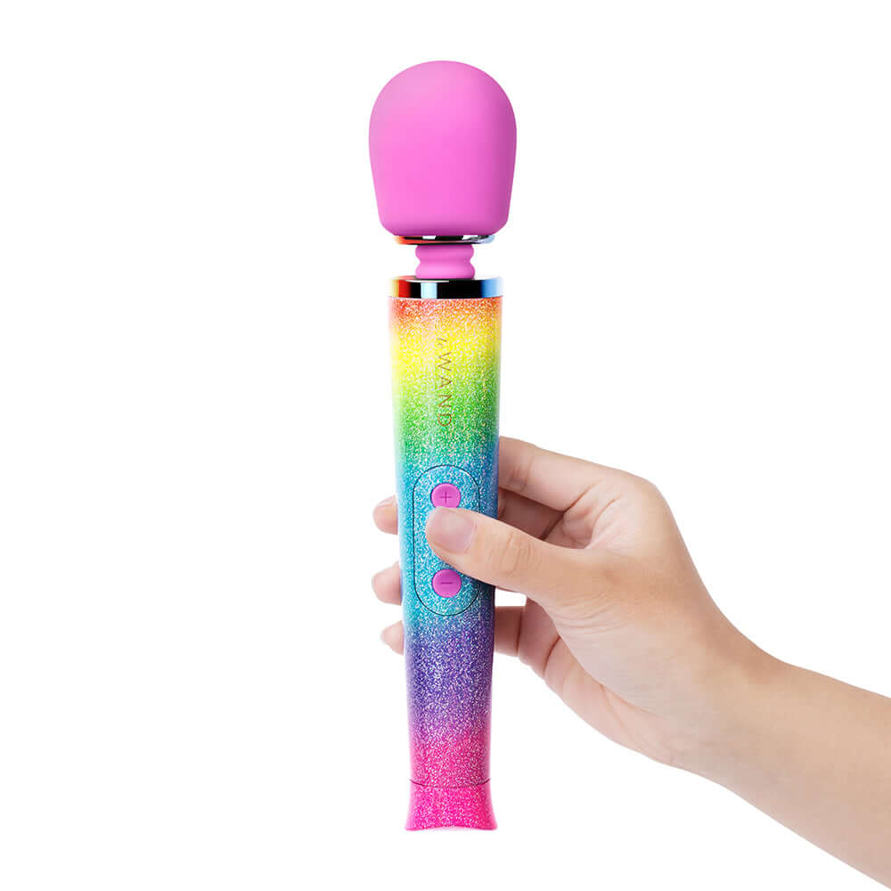 Le Wand Petite All That Glimmers Ombre held in hand showcasing vibrant rainbow ombre design and compact size.