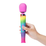 Le Wand Petite All That Glimmers Ombre held in hand showcasing vibrant rainbow ombre design and compact size.