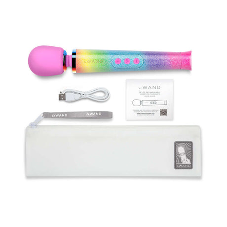 Le Wand Petite All That Glimmers Ombre wand massager with rainbow ombre finish, charging cable, and storage pouch.