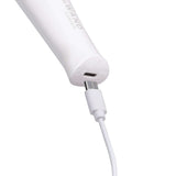 Close-up of Le Wand Classique Mini Wand Massager charging with USB cable.