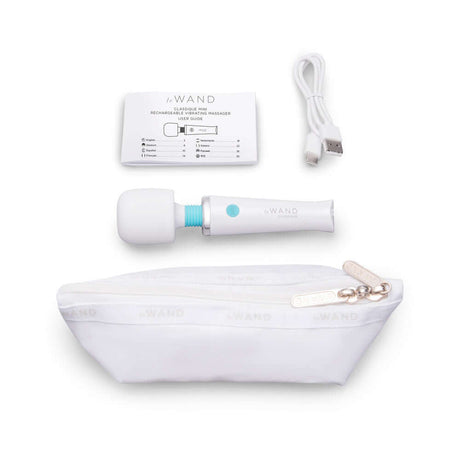 Le Wand Classique Mini Wand Massager with charging cable and storage pouch, perfect for travel and discreet use.