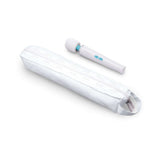 Le Wand Classique Petite Wand Massager next to its sleek carrying case, designed for relaxation and portability.