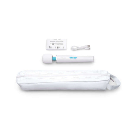 Le Wand Classique Petite Wand Massager, USB cable, instruction card, and pouch displayed on a white background.