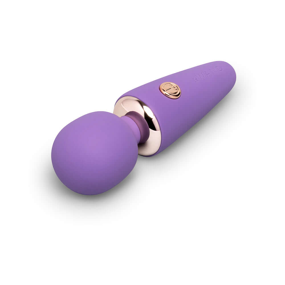 Le Wand Mini Micro Wand Massager Violet in violet color with a sleek design and gold accents, perfect for targeted vibrations.