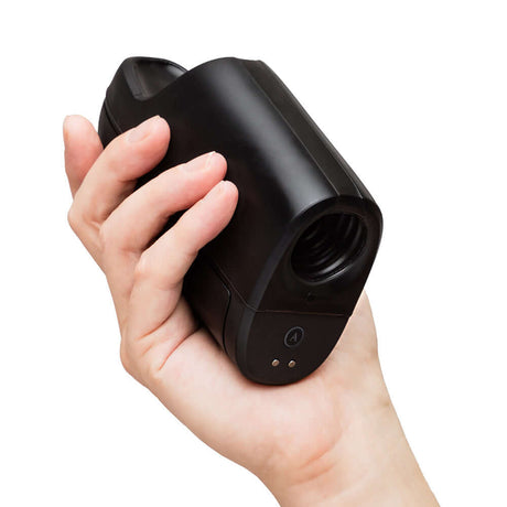 Hand holding the Arcwave Ion 2 Pleasure Air Stroker Black, showcasing its sleek design and ergonomic grip.