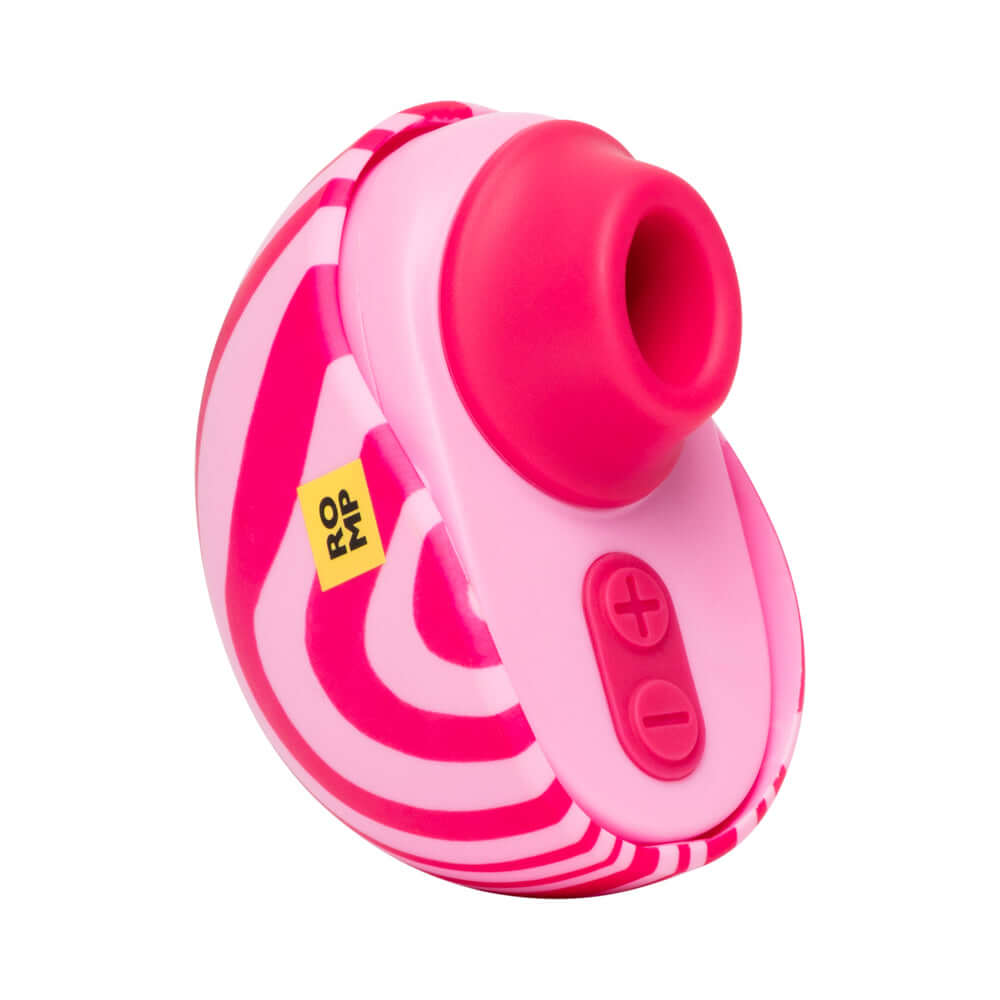 ROMP Spin Travel Rechargeable Clitoral Stimulator in pink and white design with control buttons