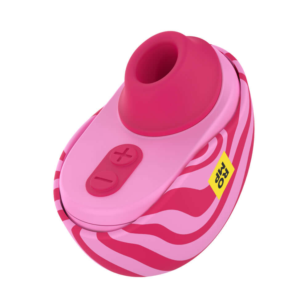 ROMP Spin Travel Rechargeable Clitoral Stimulator in pink with zebra pattern design.