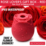 Bloomgasm The Rose Lovers Gift Box Red with waterproof clit stimulator and romantic red roses in background.