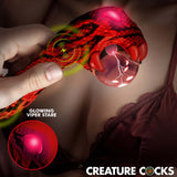 Person holding Creature Cocks Cobra Scepter Plasma Vibrator featuring glowing viper stare and intricate design.
