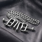 Master Series Pressure Vice Metal Nipple Clamps on a black leather background with a chain.