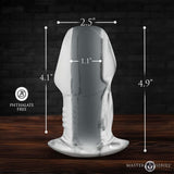 Master Series Dicked Clear Hollow Anal Plug Large with dimensions marked on a wooden background