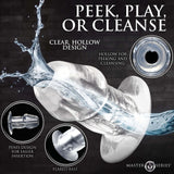 Master Series Dicked Clear Hollow Anal Plug Medium featuring a clear, hollow design for adventurous play and easy cleansing.
